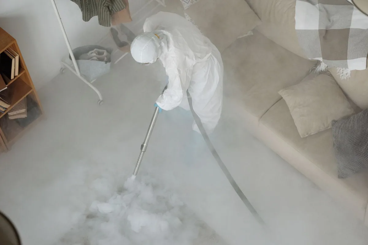 Biohazard cleanup technician in protective equipment, Charlotte, TN